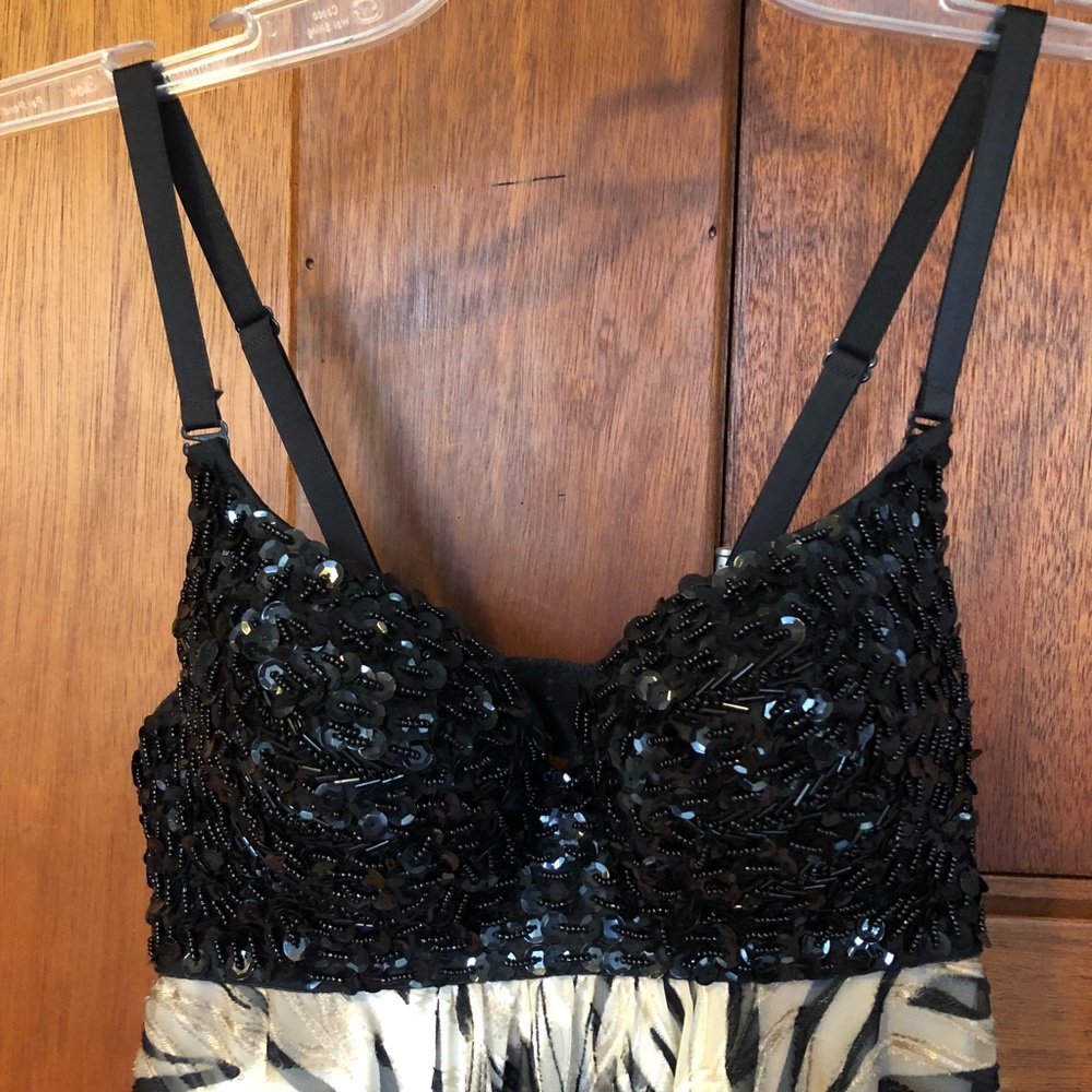 Sequined fitted top dress, flowing fabric bottom